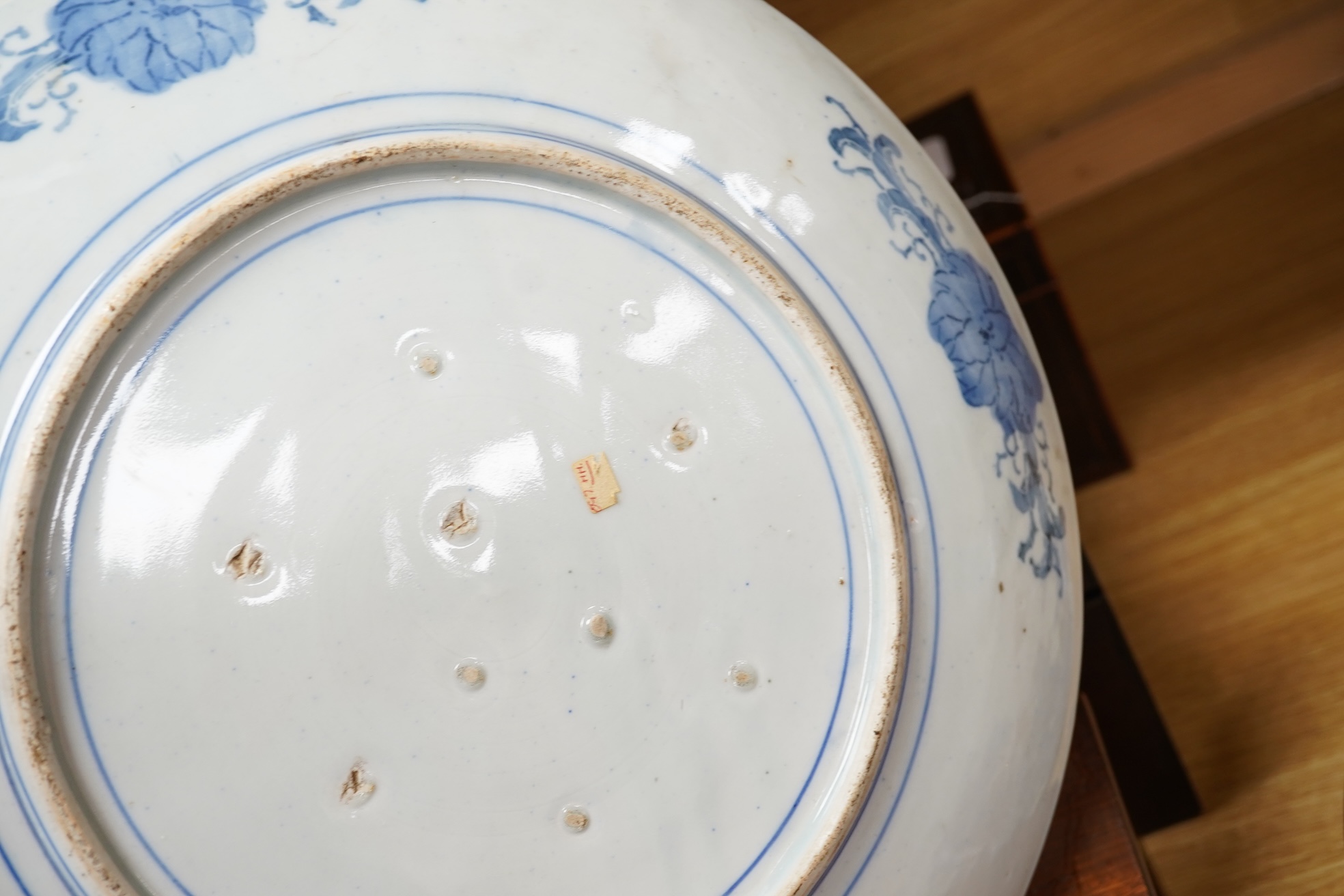 Three large Japanese dishes or chargers to include an Imari pattern example and one depicting Mount Fuji, largest 40cm in diameter